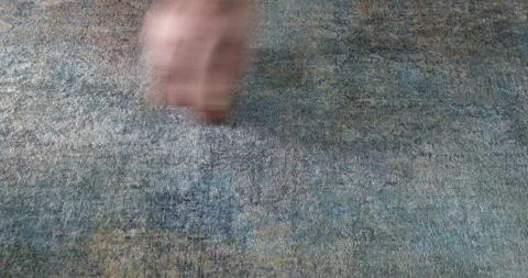 Worker brushes the carpet on the floor Stock Footage 142486753