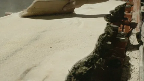 Worker brushing dust from the surface of the wood with a brush Stock Footage 87613661