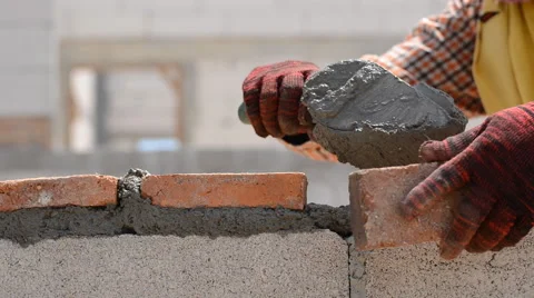 Worker build brick wall Stock Footage 52817611