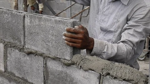 Worker build concrete wall by cement block. Stock Footage 76334284