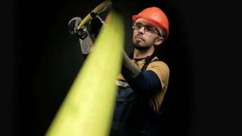 Worker, builder, engineer measures using a measuring tape. Focus shift on Stock Footage 98996926