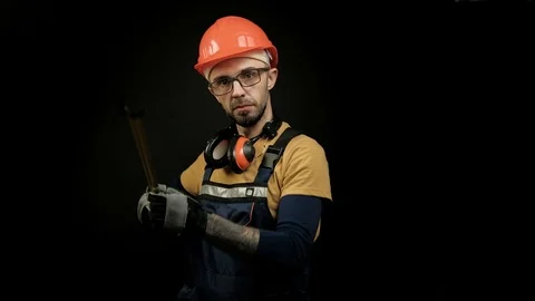 Worker, builder, engineer measures using a measuring tape. Focus shift on Stock Footage 99269949