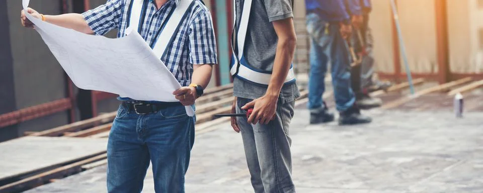 Worker builder foreman engineering occupation working with construction site Stock Photos