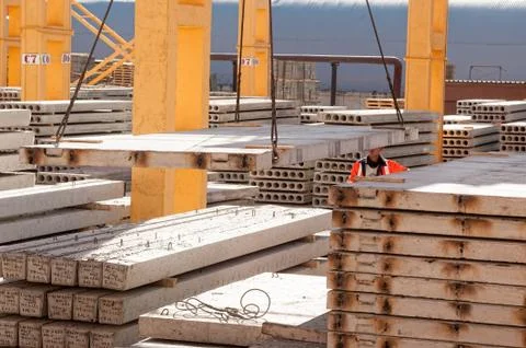 Worker builder manages construction process Stock Photos