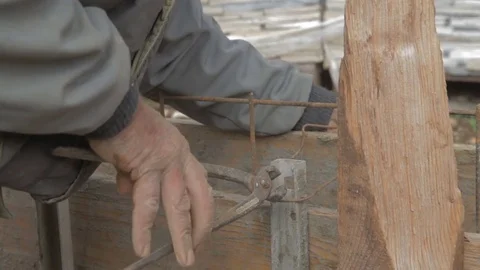 Worker building armature with a wire Stock Footage 73464849