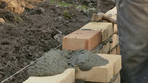 Worker building brick wall Stock Footage 81860874