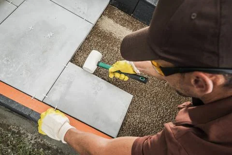 Worker Building Concrete Bricks Path Inside Residential Garden Stock Photos