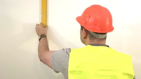 Worker with a building level Stock Footage 93306927