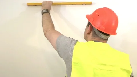 Worker with a building level Stock Footage 93306935