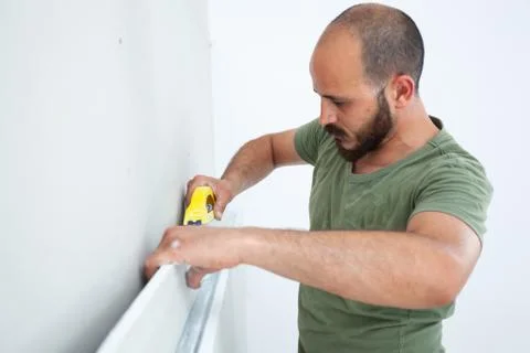 Worker building plasterboard wall. Stock Photos