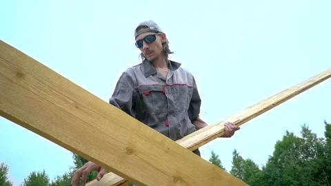 The worker is building the roof Stock Footage 92616716