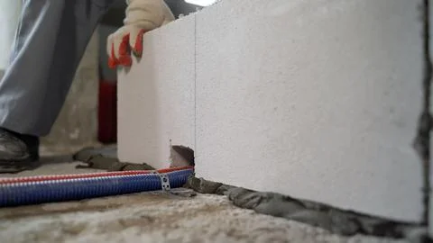 Worker Building Wall With Concrete Blocks 写真素材