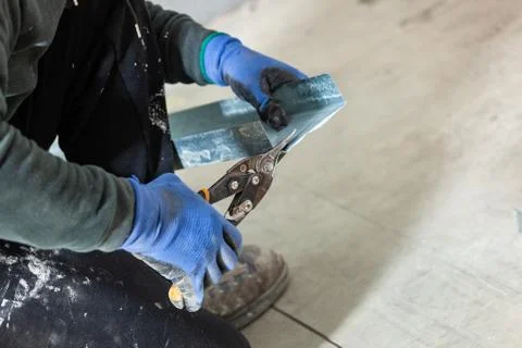 Worker builds a plasterboard wall. Stock Photos