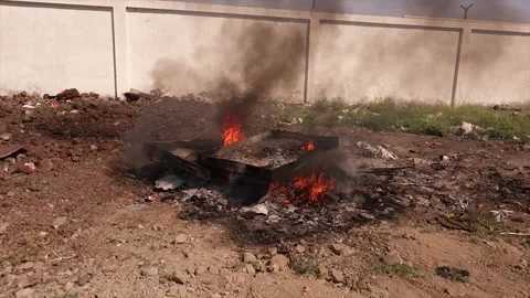 Worker is burning the casting west in outside of factory Stock Footage 305996819