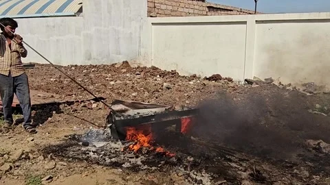 Worker is burning the casting west in outside of factory Video stock 305996845