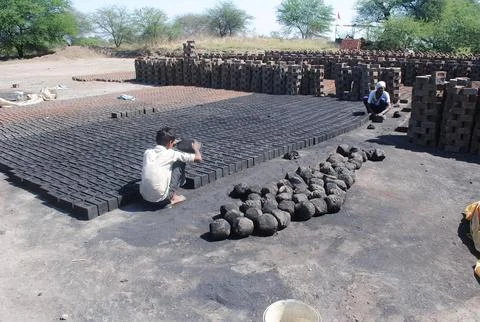 Worker busy at brick making  Stock Photos