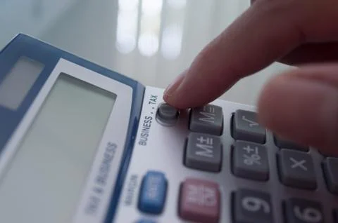 Worker calculating tax Stock Photos