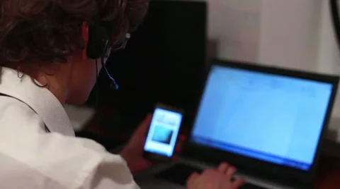Worker Call Center Uses a Touchscreen Phone Stock Footage 57111293