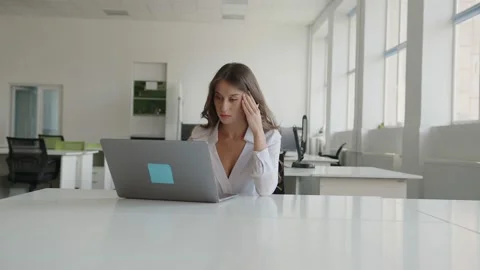 Worker can't concentrate on her online work Video stock 157968082