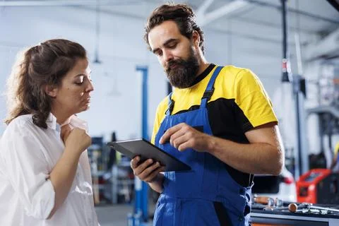 Worker in car service orders components 스톡 사진