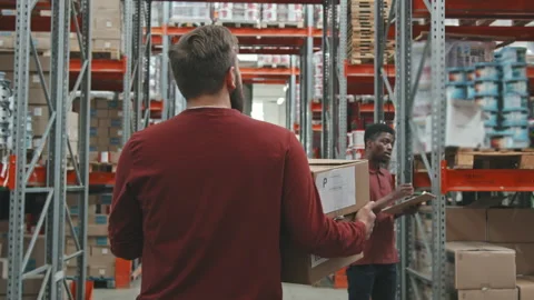 Worker with Cardboard Boxes Walking in Warehouse Stock Footage 159120525