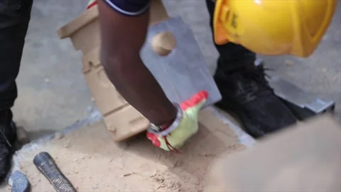 Worker carefully handling a sand mold during the sand casting process i Stock Footage 321339296