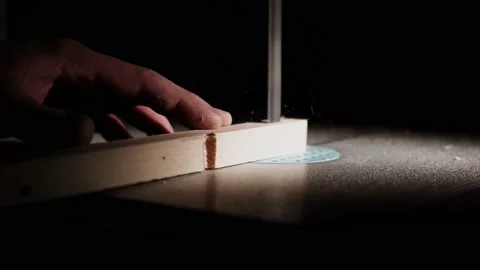 Worker in the carpentry workshop cuts the log into boards using band saw. Jo Stock Footage 231906653