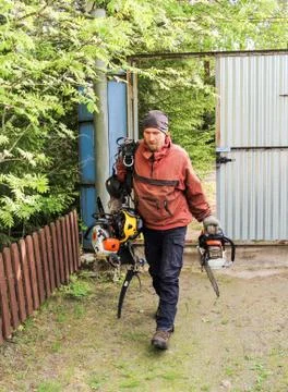 The worker carries the tool. Stock Photos