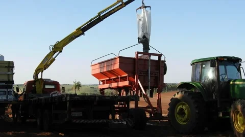 Worker carry an agricultural machine Stock Footage 156352700