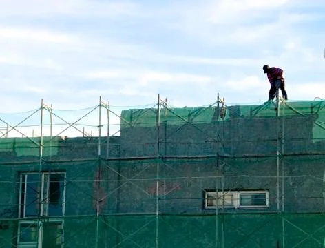 Worker carrying drill Stock Photos