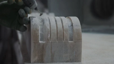 Worker carving marble, part of the fire-column, closeup Video stock 99039086