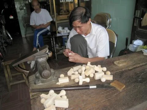 Worker carving seals Stock Photos