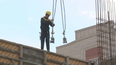 Worker catches crane slings. Stock Footage 55242722