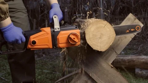 Worker with chainsaw cutting wood. Stock Footage 89558369