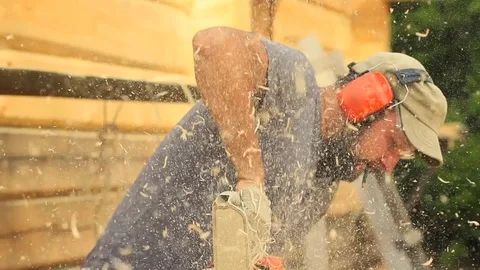 Worker chainsaw sawdust Stock Footage 79589369
