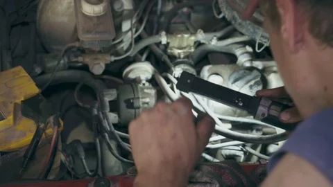 Worker changes the timing belt in the car Stock Footage 110863427