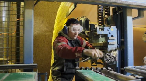 Worker changing a drill on woodworking machines cnc. Woodworking. Video stock 61381529