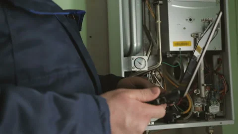 Worker checking gas-fire boiler Video stock 87762299