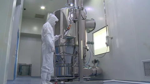 Worker checking machinery in factory. pharm industry Stock Footage 67572822