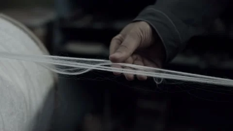 The worker checking quality of fiber indoors. Stock Footage 154697759