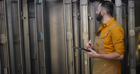 Worker checking the quality of metal products with a digital tablet Video stock 147286785