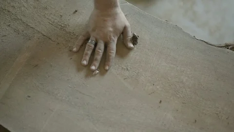 Worker checking the smoothness of wood Stock Footage 87613549