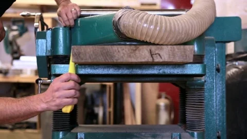 Worker checking thickness of wood in planer 스톡 동영상 79471033