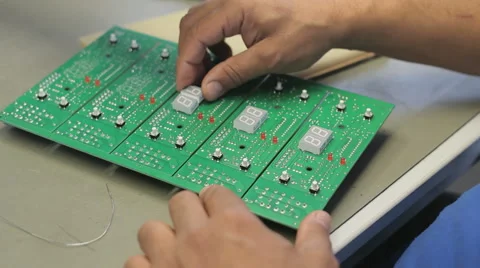 A worker checks circuit boards - Surface Mount Technology (Smt) Stock Footage 54198159
