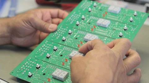 A worker checks circuit boards - Surface Mount Technology (Smt) Stock Footage 54198438