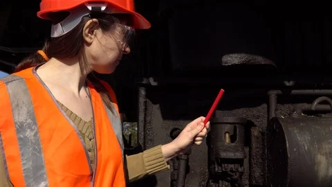 A worker checks of the hydraulic system of a career excavator. Stock Footage 89313980