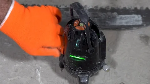 Worker checks the laser level Stock Footage 115419010