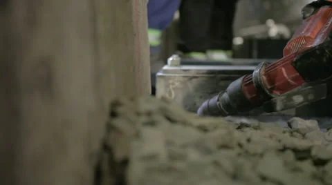 Worker chipping away concrete with jackhammer Stock Footage 44286387