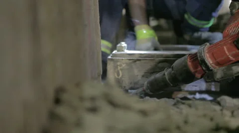 Worker chipping away concrete with jackhammer Stock Footage 44286955