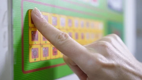 Worker choosing program for machine dry cleaning Stock Footage 108185120